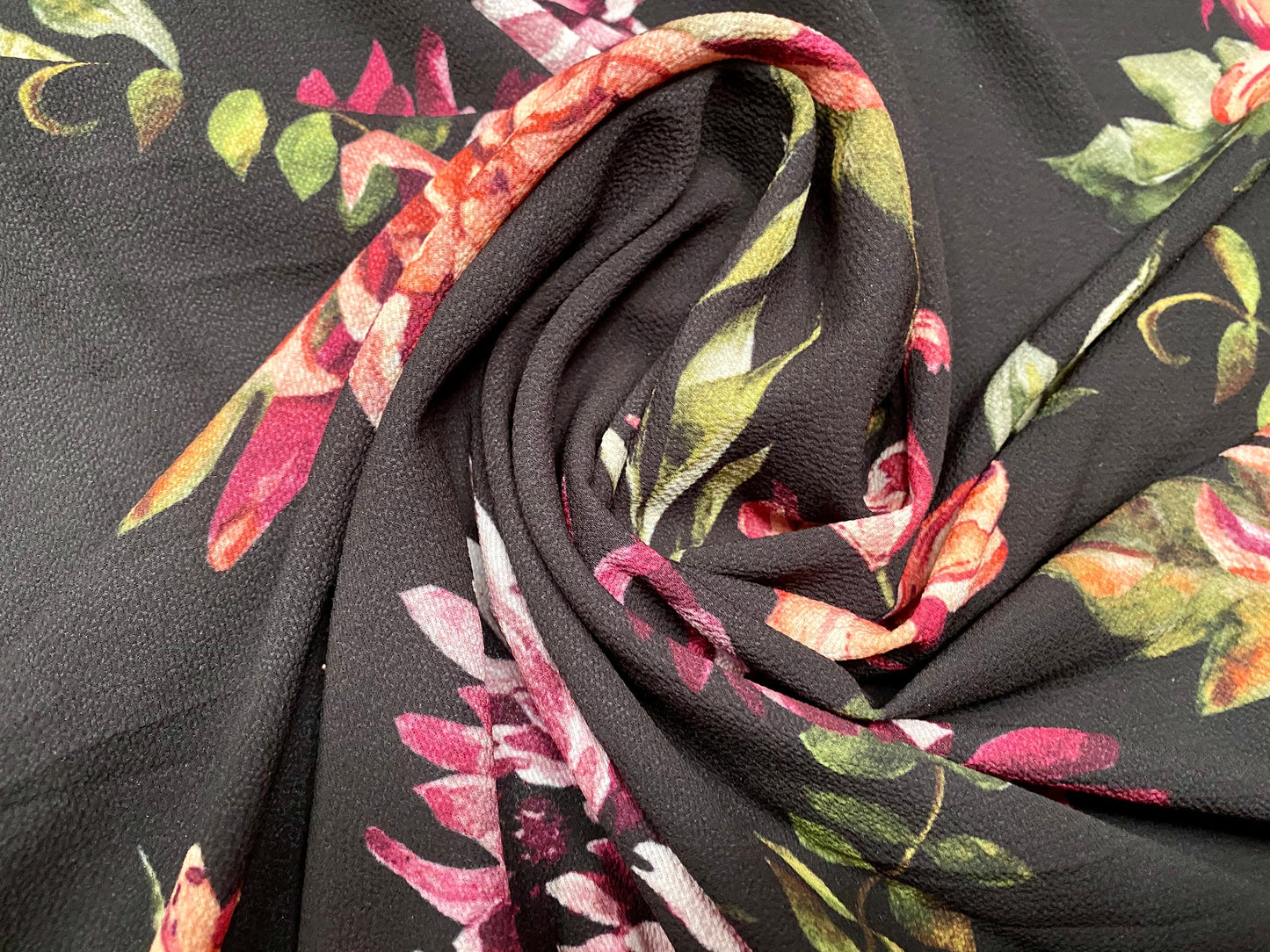 Floral printed pebble crepe dress fabric, per metre - black with pink orchid