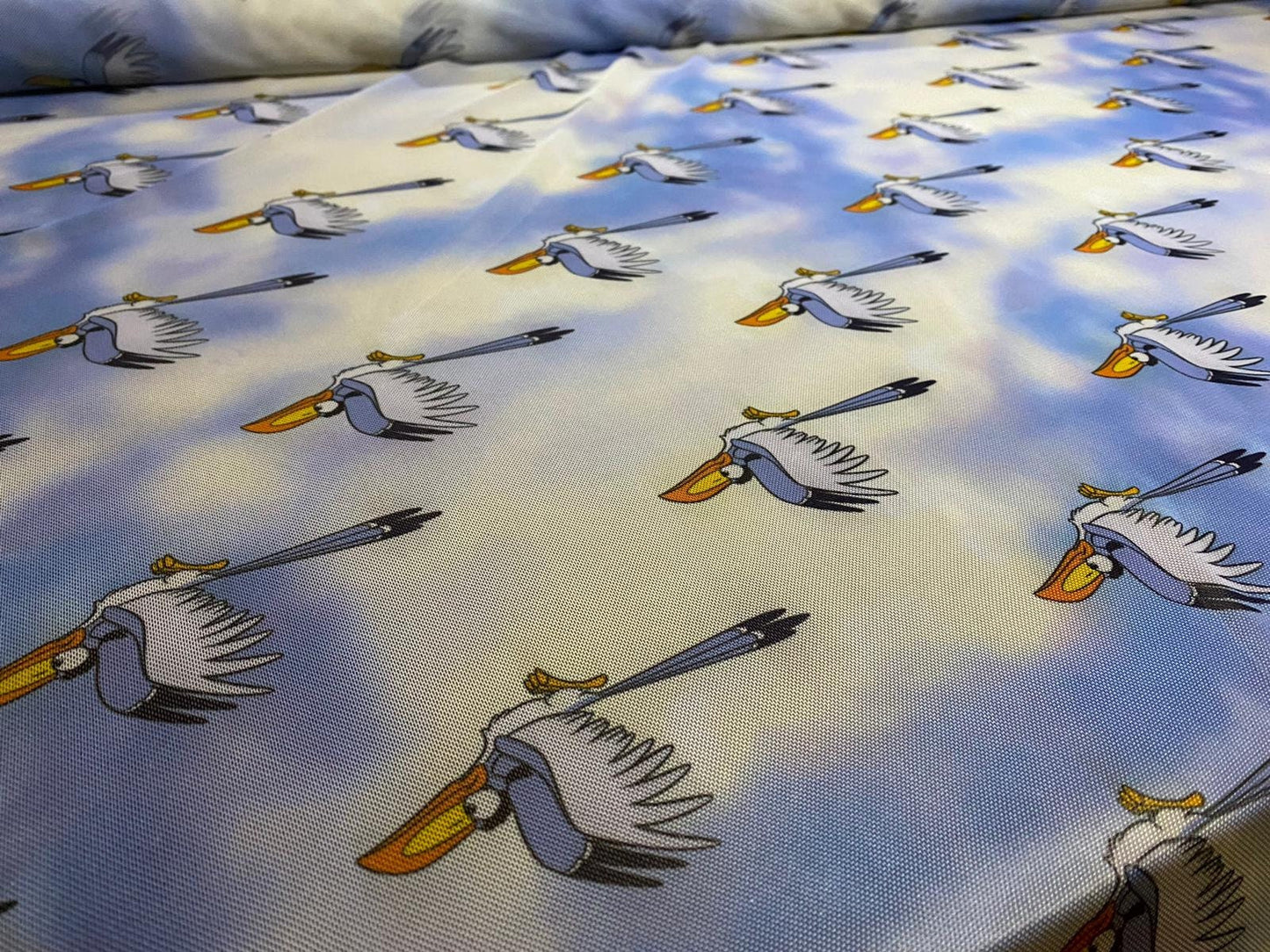 Power mesh net stretch fabric, per metre - blue stork bird in the clouds print