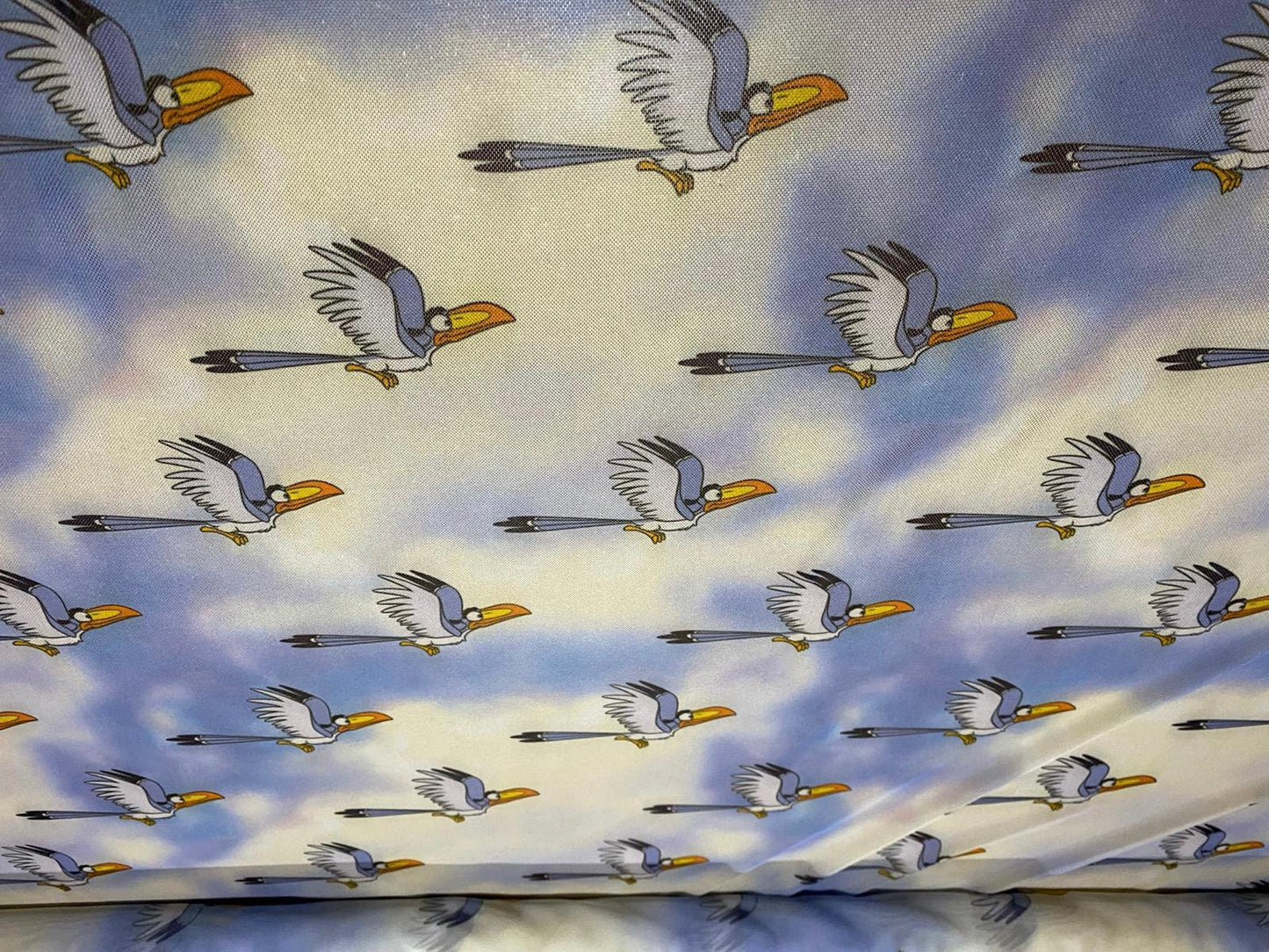 Power mesh net stretch fabric, per metre - blue stork bird in the clouds print