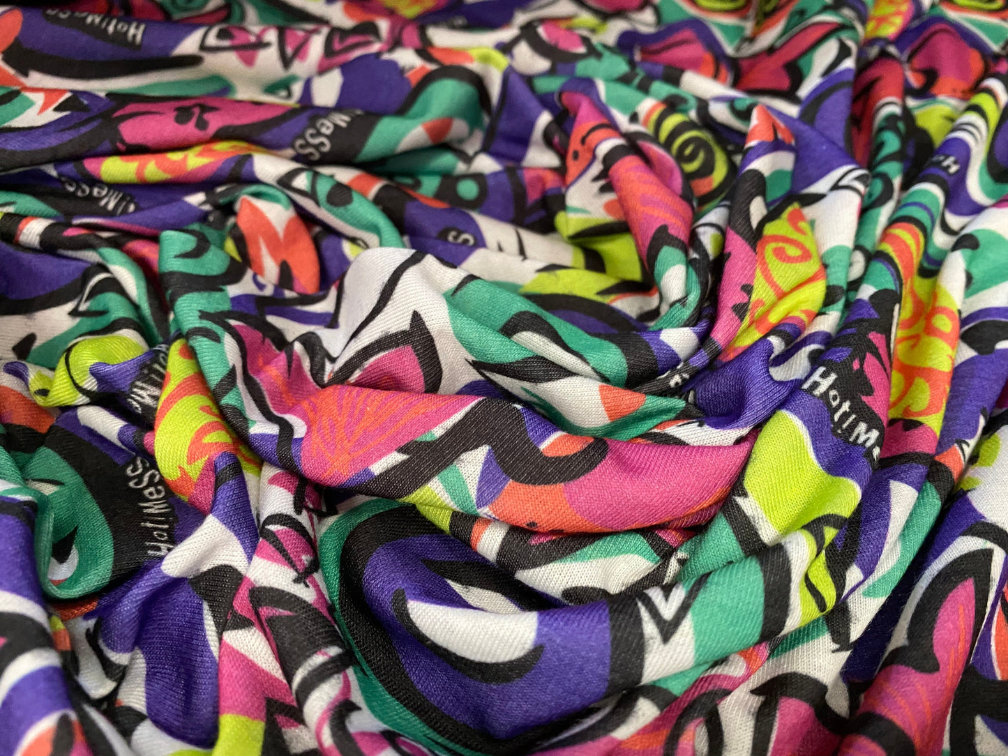 Soft handle jersey dress fabric, per metre - urban graffiti street art print hot mess