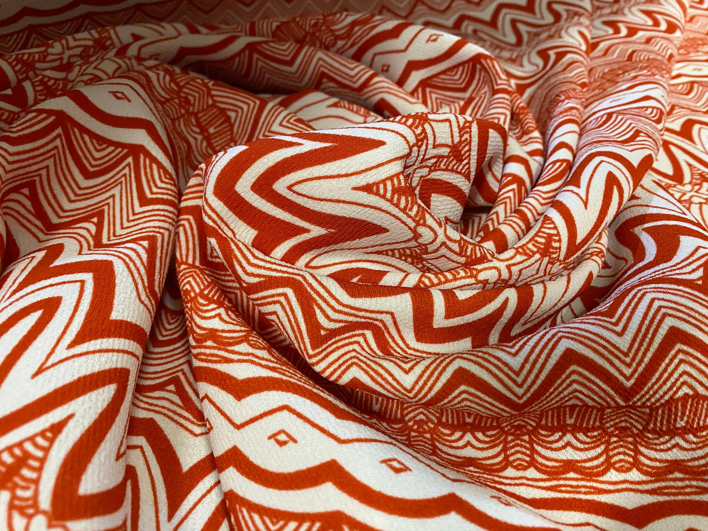 Heavyweight moss crepe woven dress fabric with comfort stretch - zig zag print - burnt orange