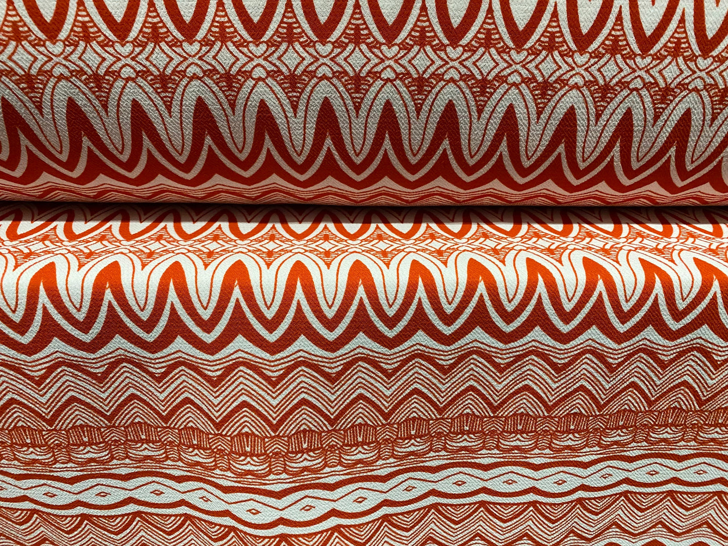 Heavyweight moss crepe woven dress fabric with comfort stretch - zig zag print - burnt orange