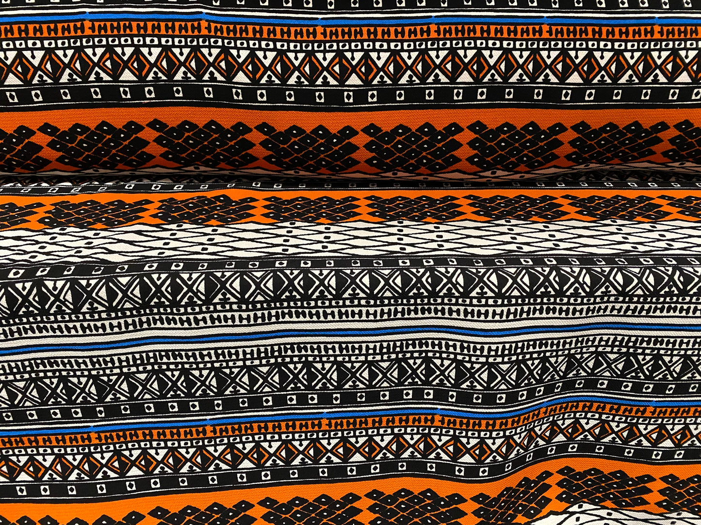 Heavyweight moss crepe woven dress fabric with comfort stretch - Aztec stripe print - orange