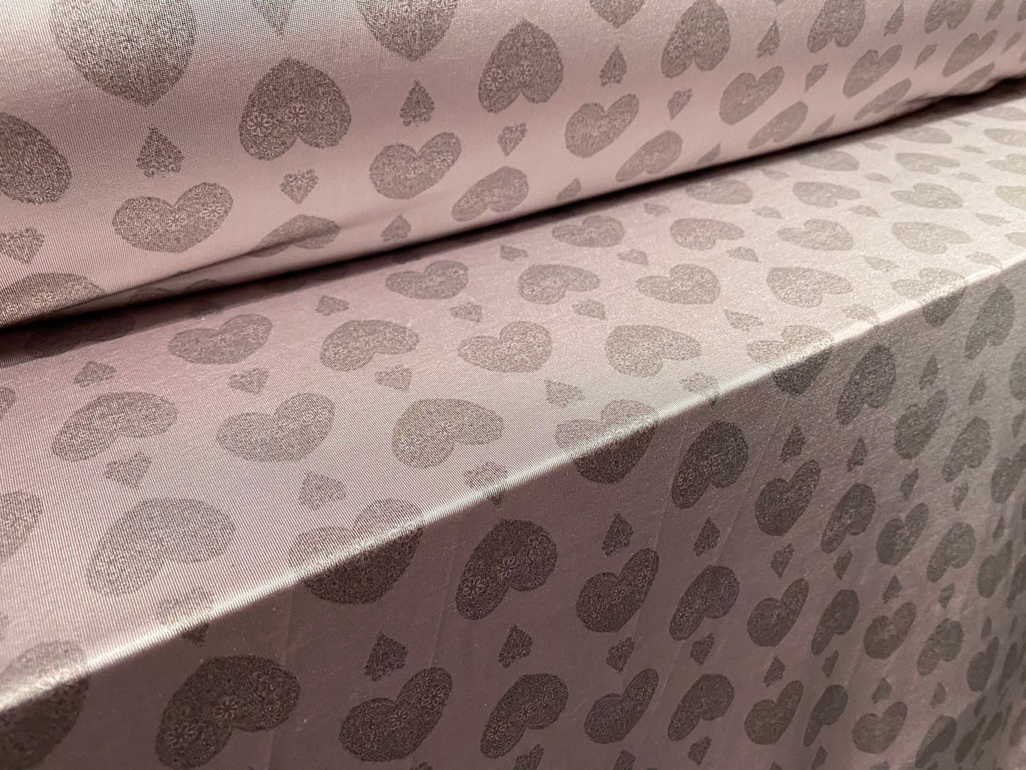 Disco shimmer stretch jersey fabric, per metre - lilac with grey love heart print