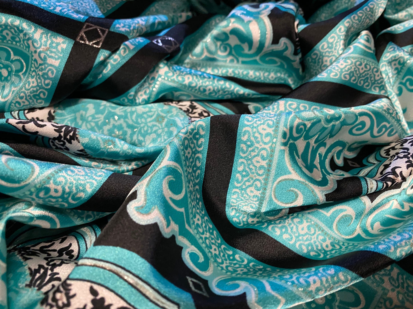 Silky Stretch satin dress fabric, per metre - paisley geometric print - black & turquoise