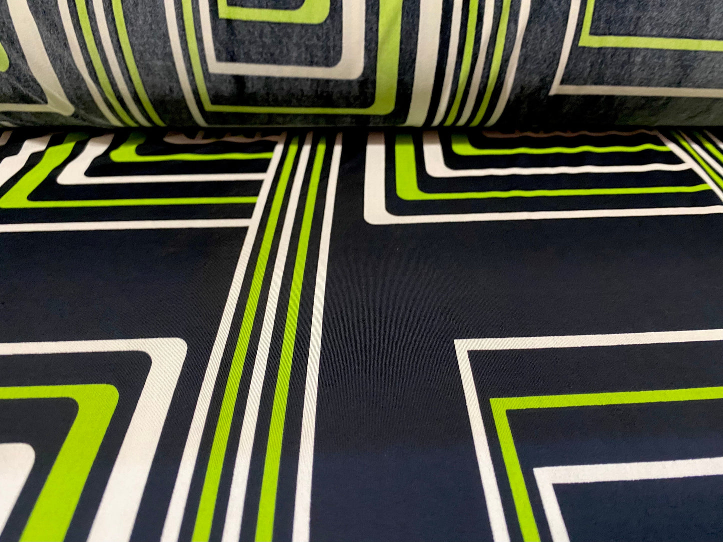 Spandex stretch ITY jersey fabric, per metre - black with black & green retro geometric print