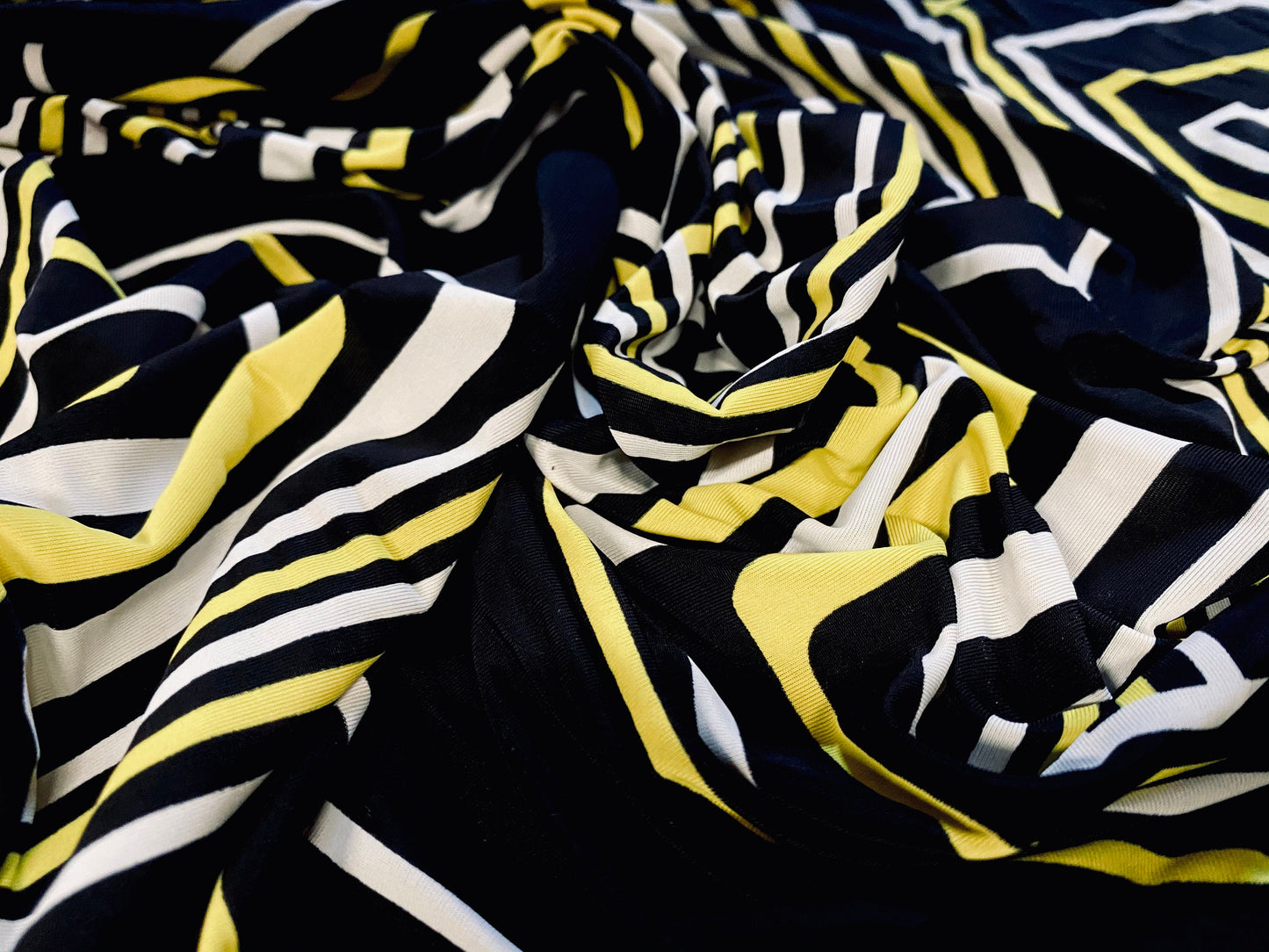 Spandex stretch ITY jersey fabric, per metre - black with black & yellow retro geometric print