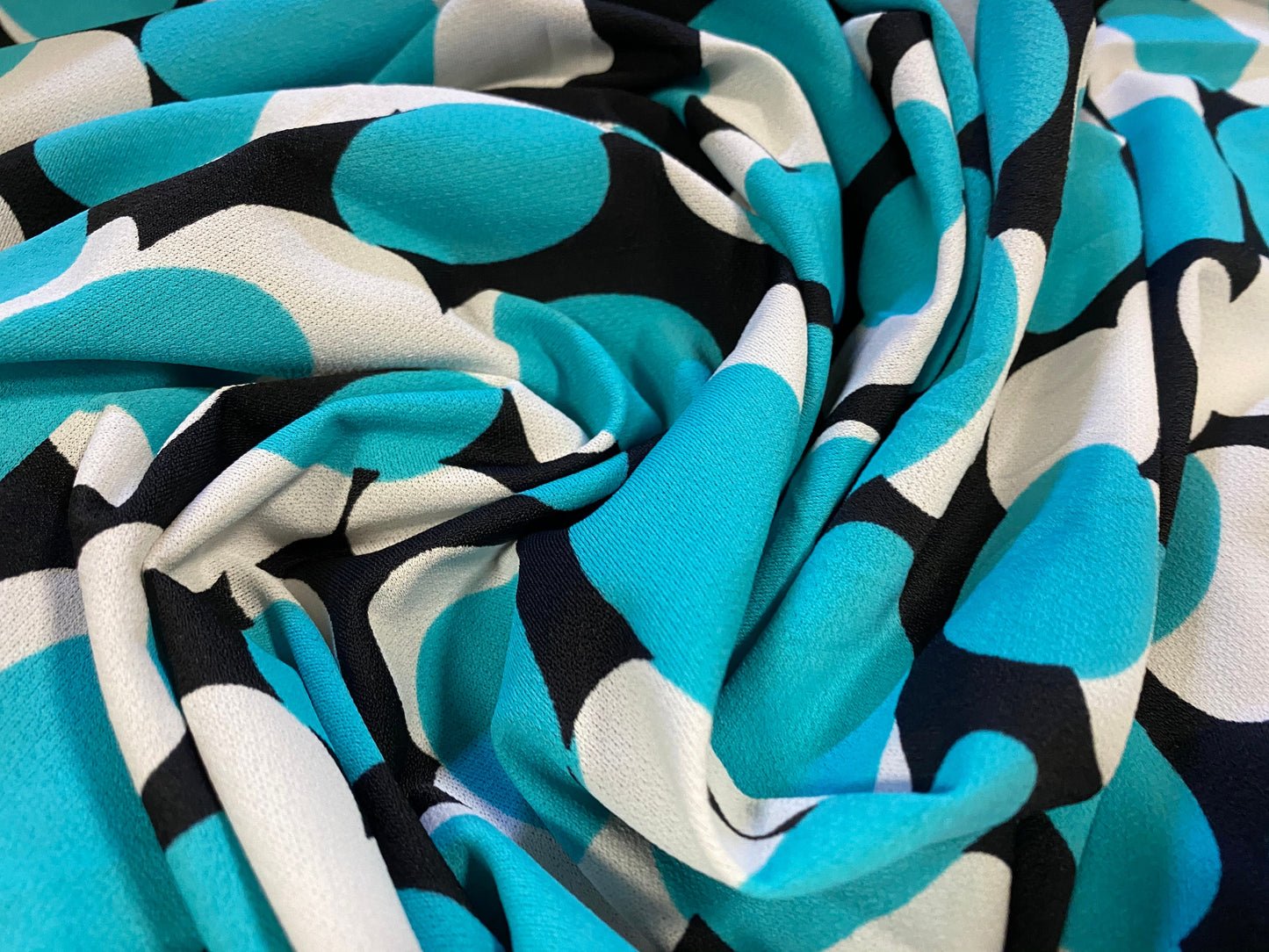 Stretch Spandex crepe jersey fabric, per metre - turquoise & black circles print