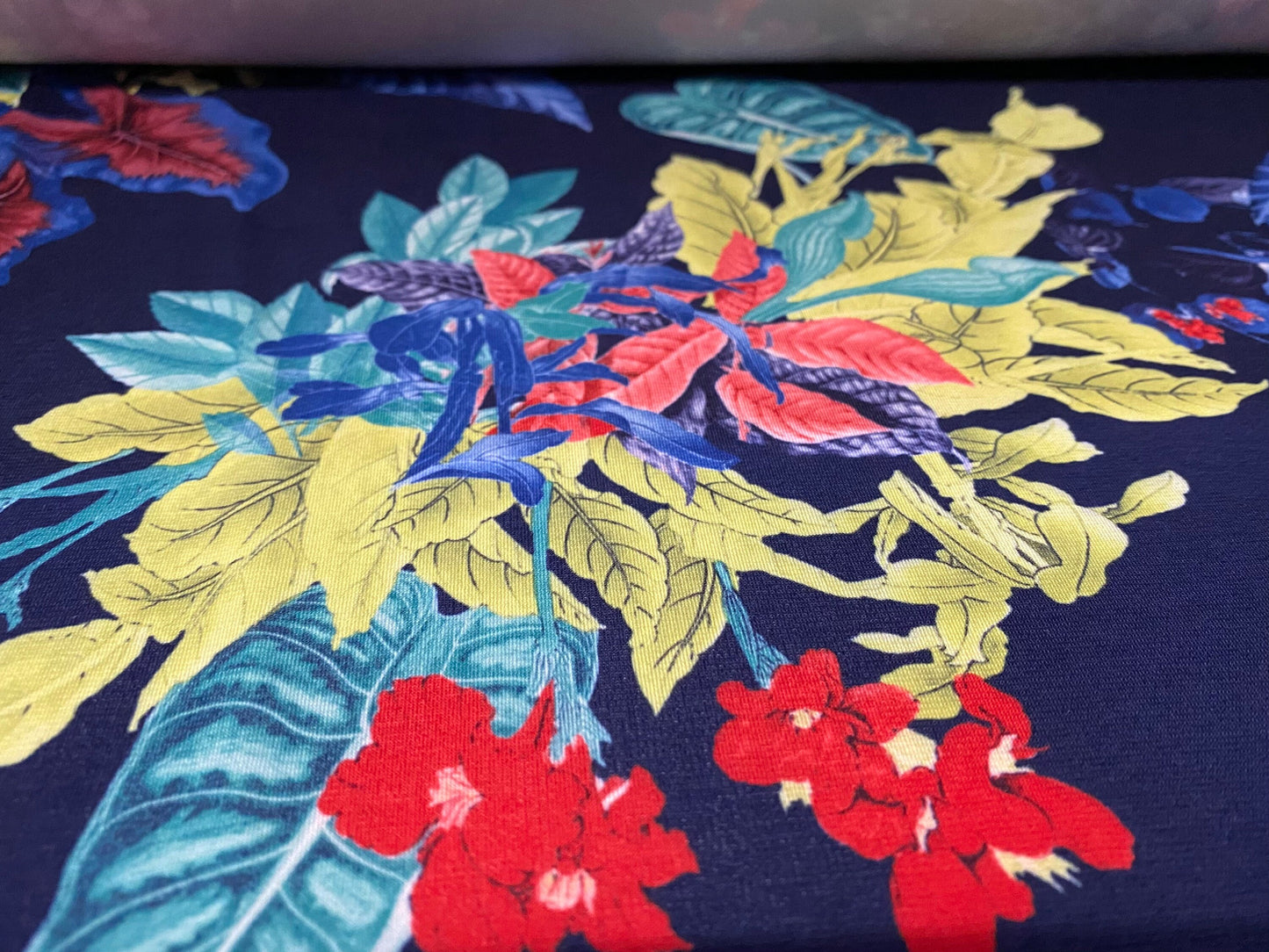Soft touch stretch spandex jersey fabric, per metre - navy with leaf bouquet print