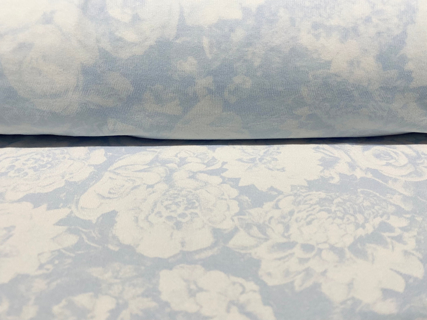 Sheer stretch lightweight jersey fabric, per metre - pale blue rose print