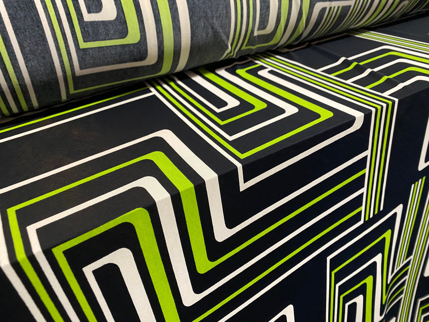 Spandex stretch ITY jersey fabric, per metre - black with black & green retro geometric print