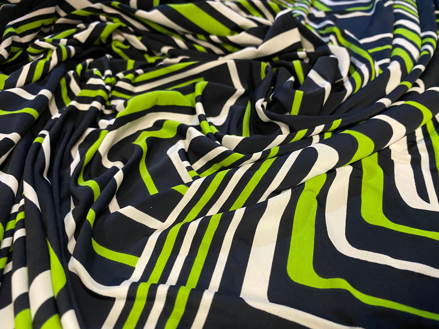Spandex stretch ITY jersey fabric, per metre - black with black & green retro geometric print