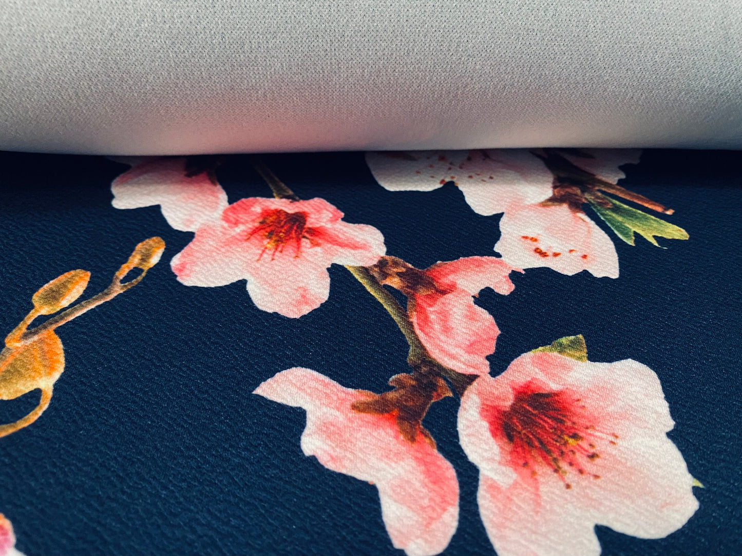 Scuba textured ‘Liverpool’ stretch spandex jersey fabric, per metre - Navy with pink blossom print