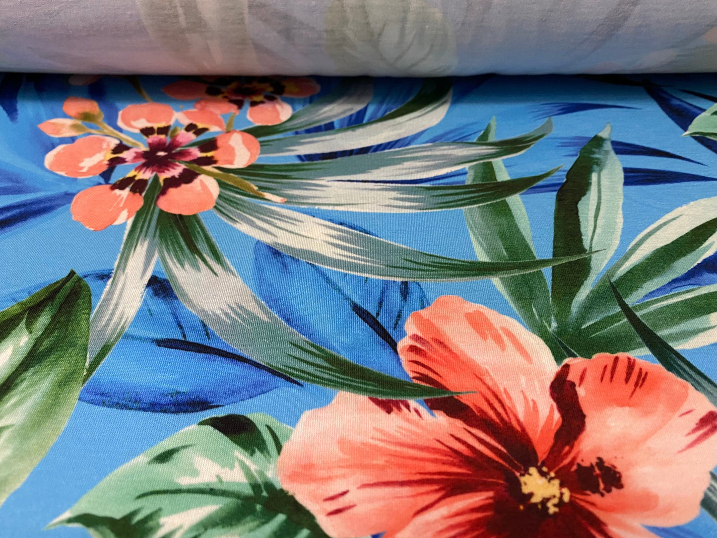 Soft handle stretch jersey fabric, per metre - blue with pink orchid print