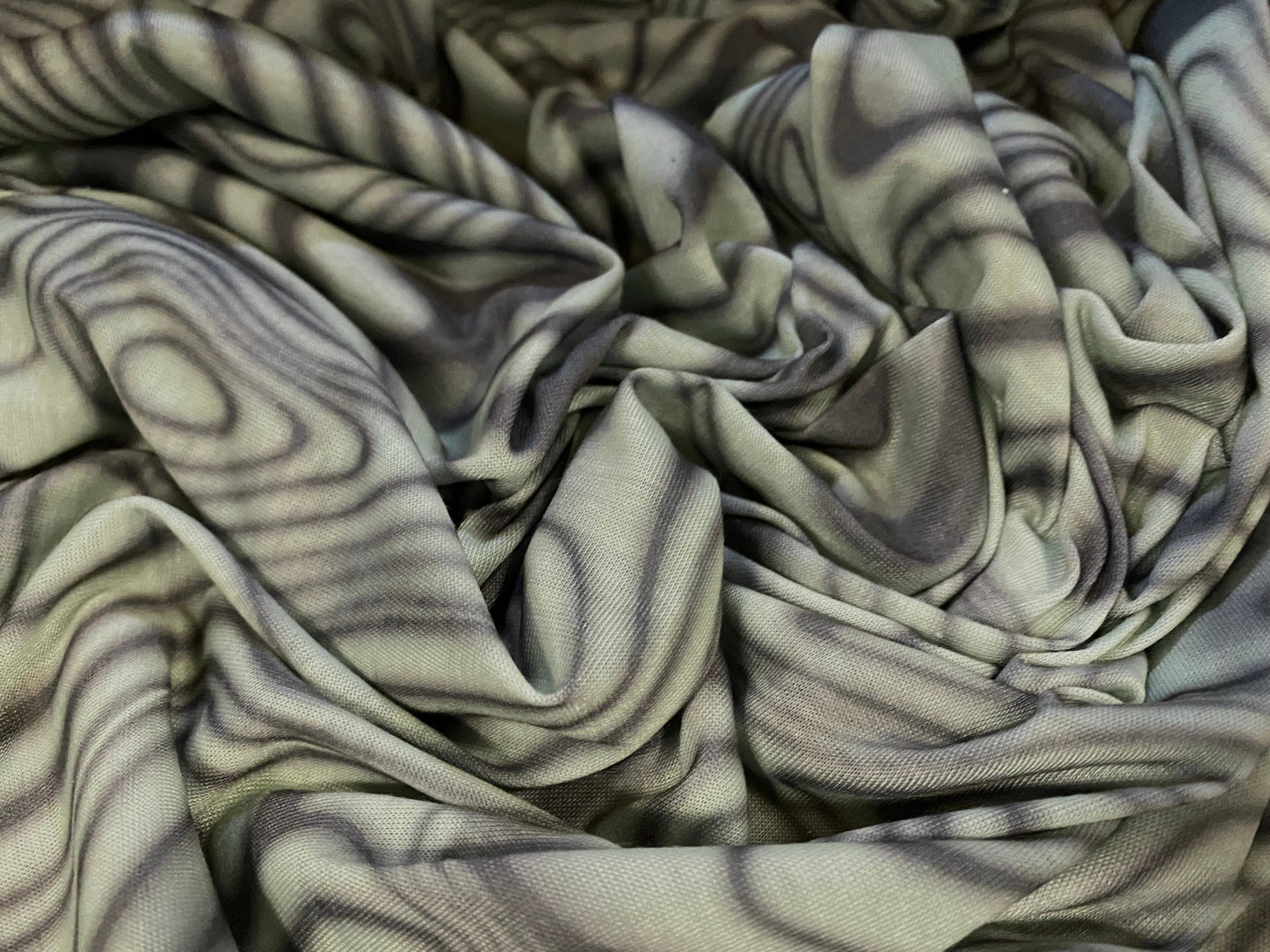 Soft handle jersey fabric, per metre - psychedelic swirl print - sage green