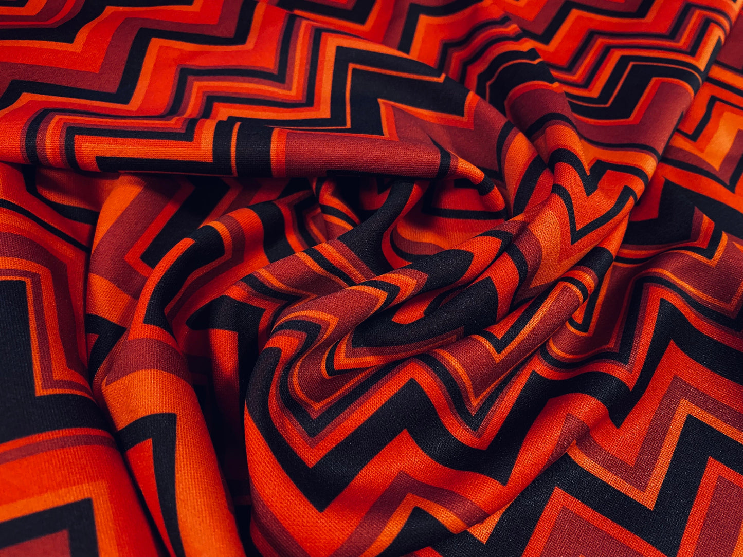 Scuba spandex stretch neoprene style jersey fashion fabric, per metre - Chevron print - dark orange & black