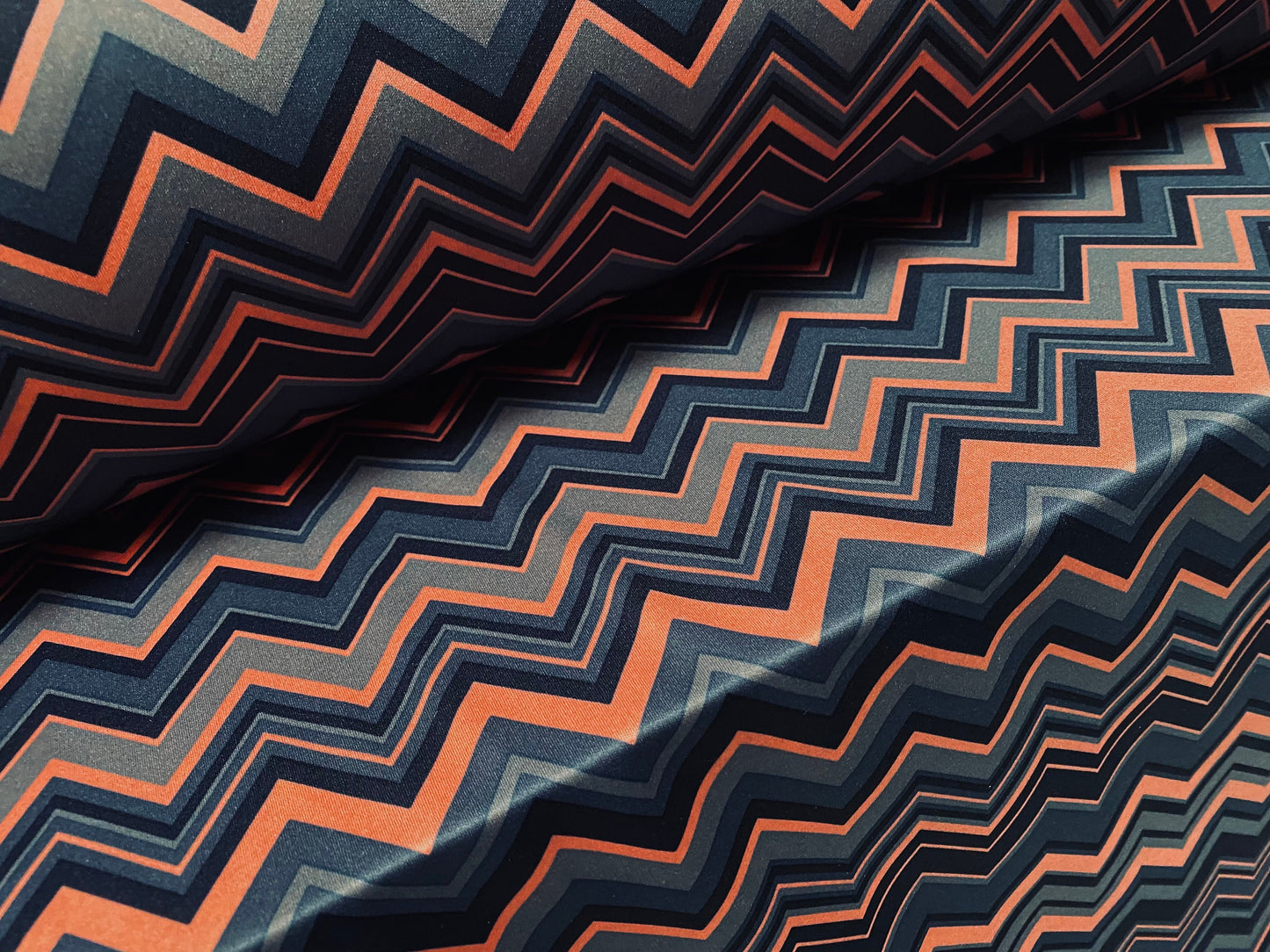 Single jersey polyester fabric - 60 inches wide - chevron zigzag print - pink & steel blue