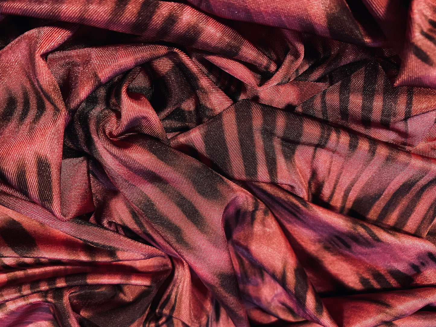 Disco shimmer stretch jersey fabric, per metre - stylised animal print - fuschia