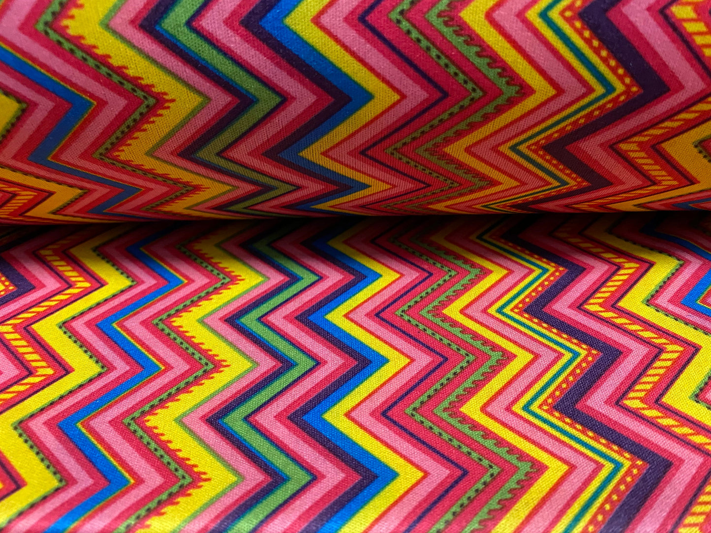 Single jersey polyester fabric - 60 inches wide - tutti frutti zigzag print - yellow & pink