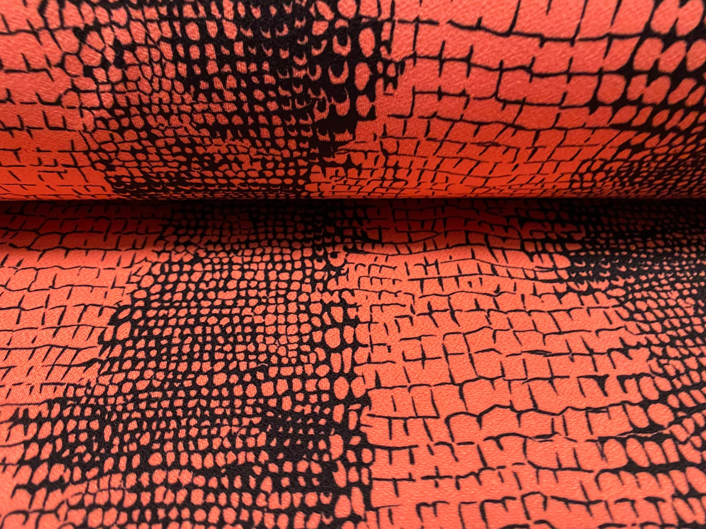 Stretch Spandex crepe single jersey fabric - distressed alligator print - coral