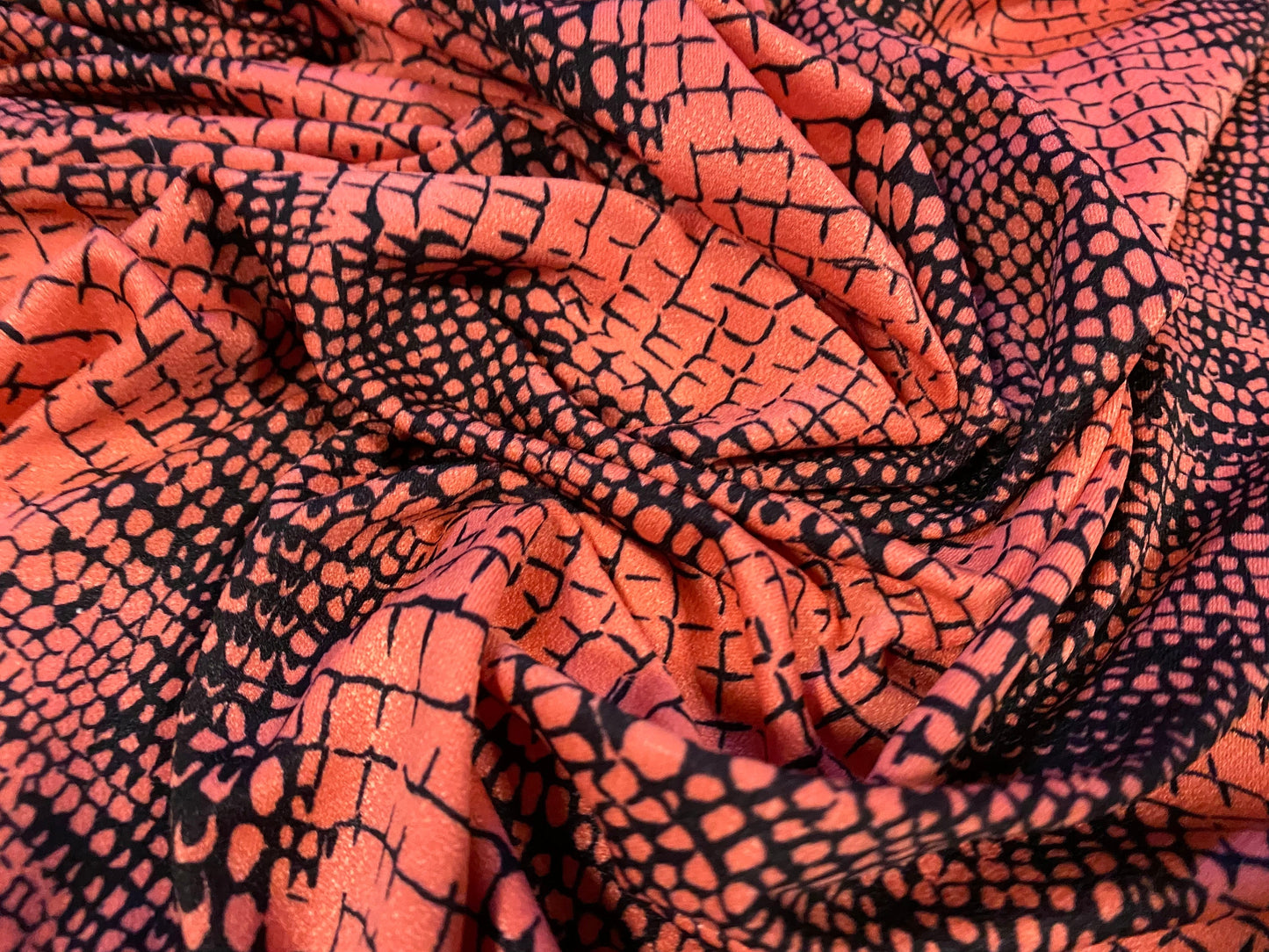 Stretch Spandex crepe single jersey fabric - distressed alligator print - coral