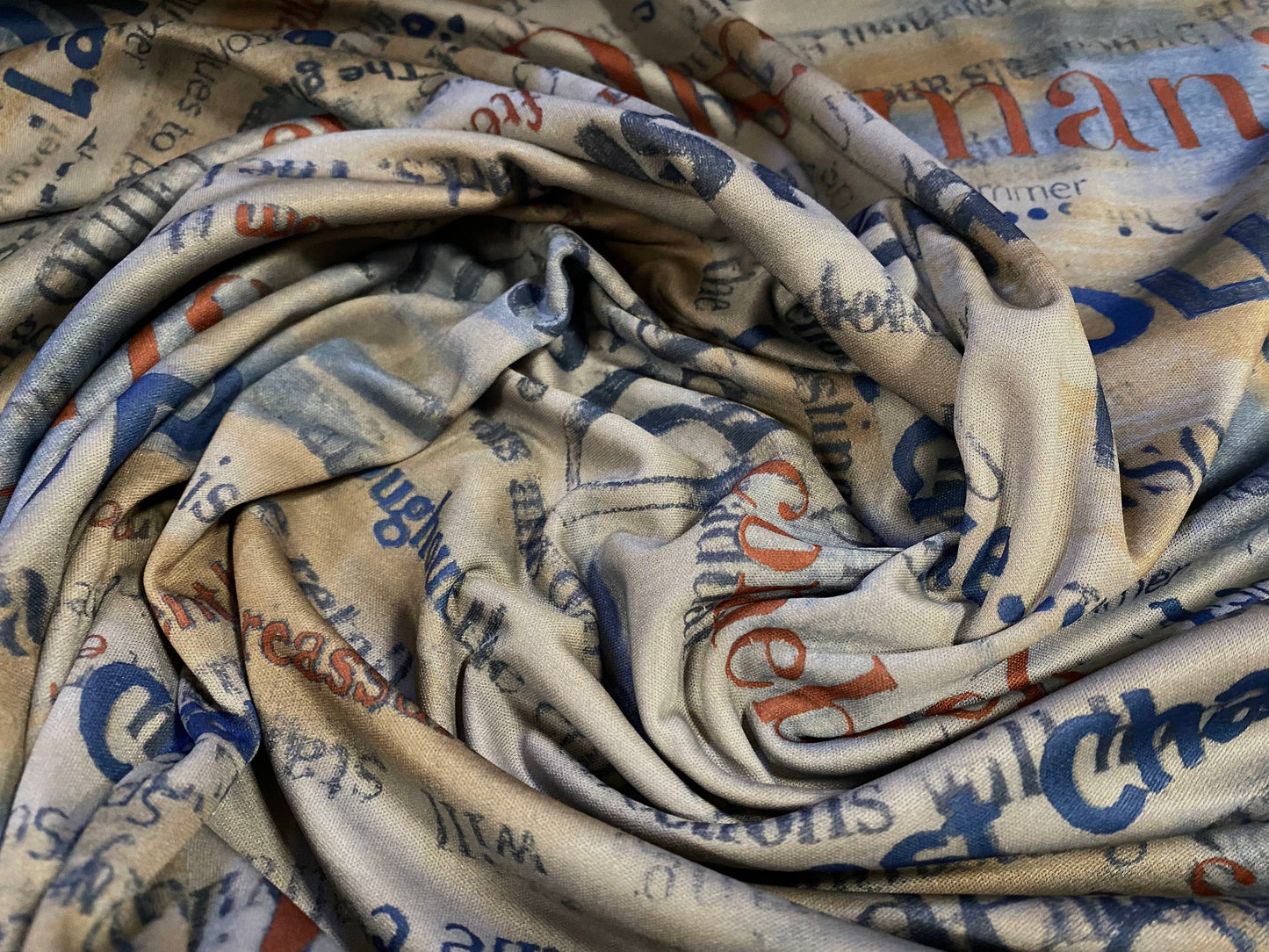 Single jersey polyester fabric - 60 inches wide - discomania writing print - earth tones