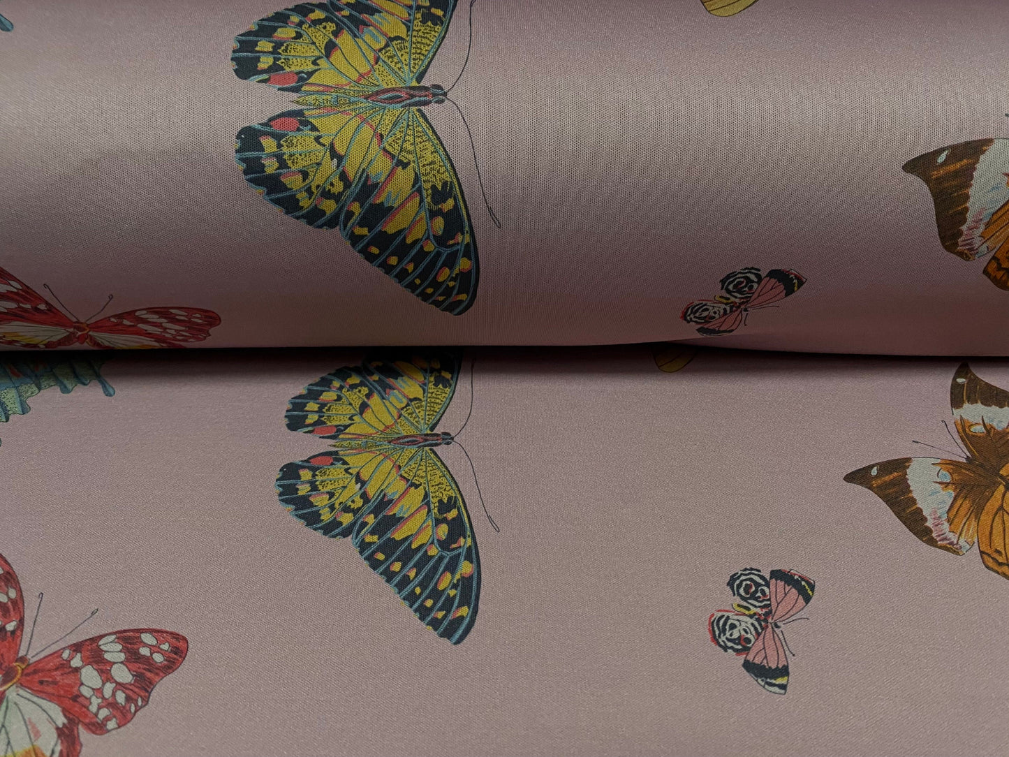 Single jersey polyester fabric - 60 inches wide - butterfly print - dusky mauve