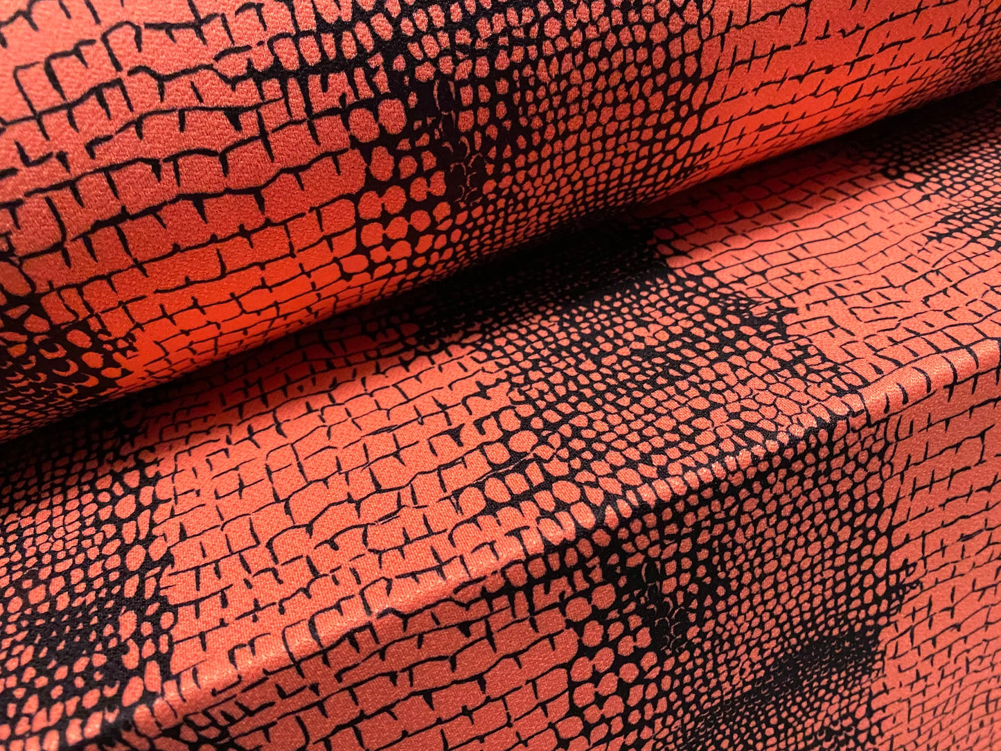 Stretch Spandex crepe single jersey fabric - distressed alligator print - coral