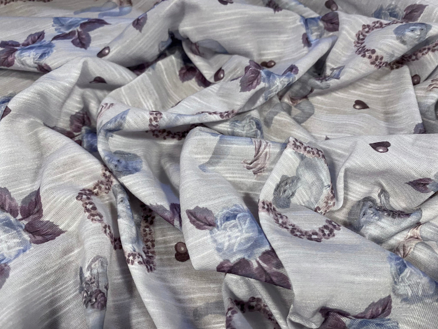 Soft handle single jersey printed fabric, per metre - Cupid in a love-heart print - pale blue
