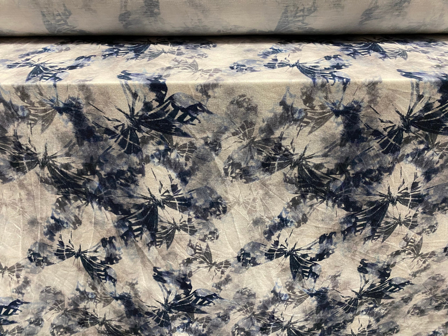 Soft handle stretch jersey fabric, per metre - distressed butterfly print - Petrol blue grey