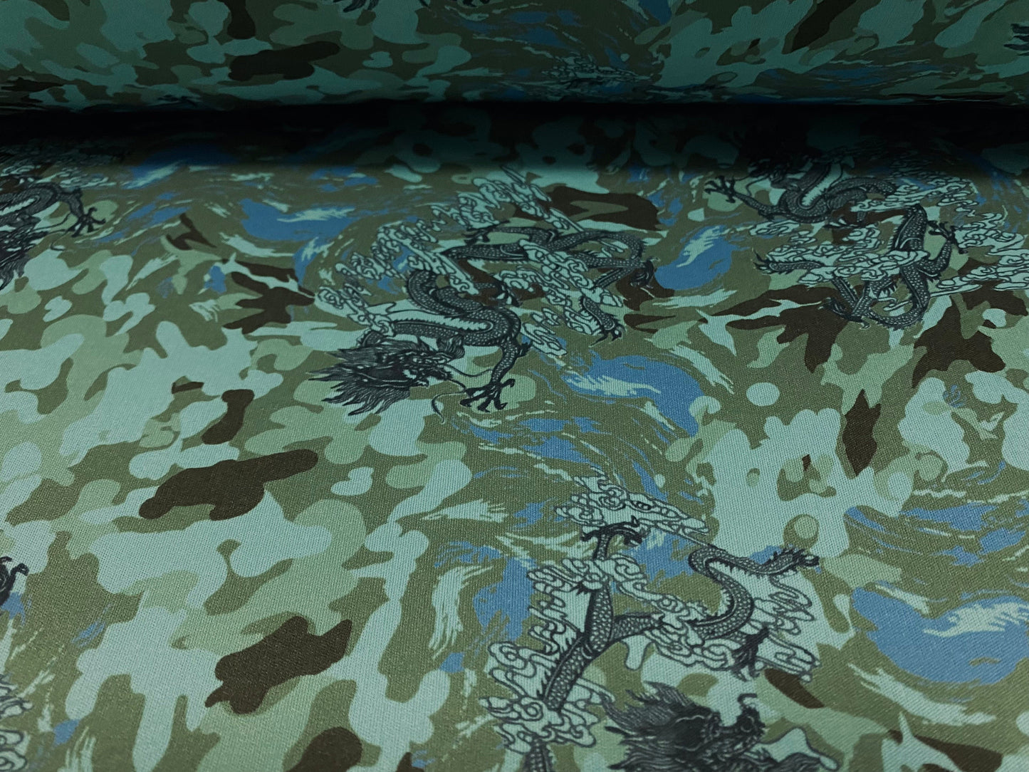 Single jersey polyester fabric - 60 inches wide - Camouflage dragon print - turquoise & green