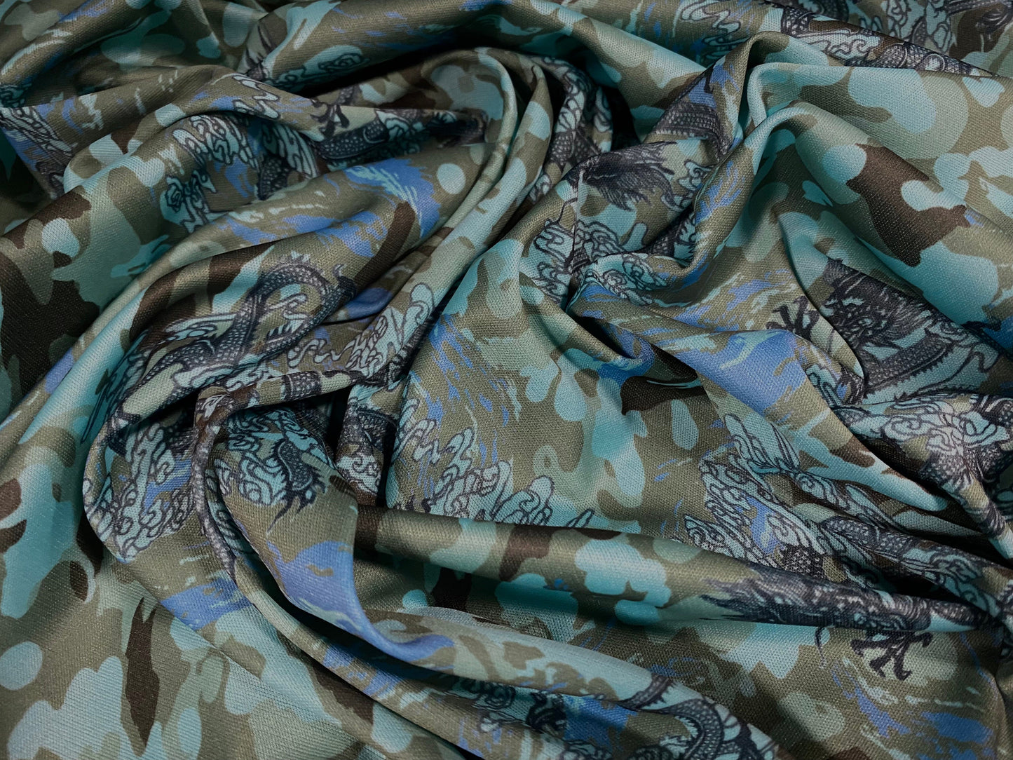 Single jersey polyester fabric - 60 inches wide - Camouflage dragon print - turquoise & green
