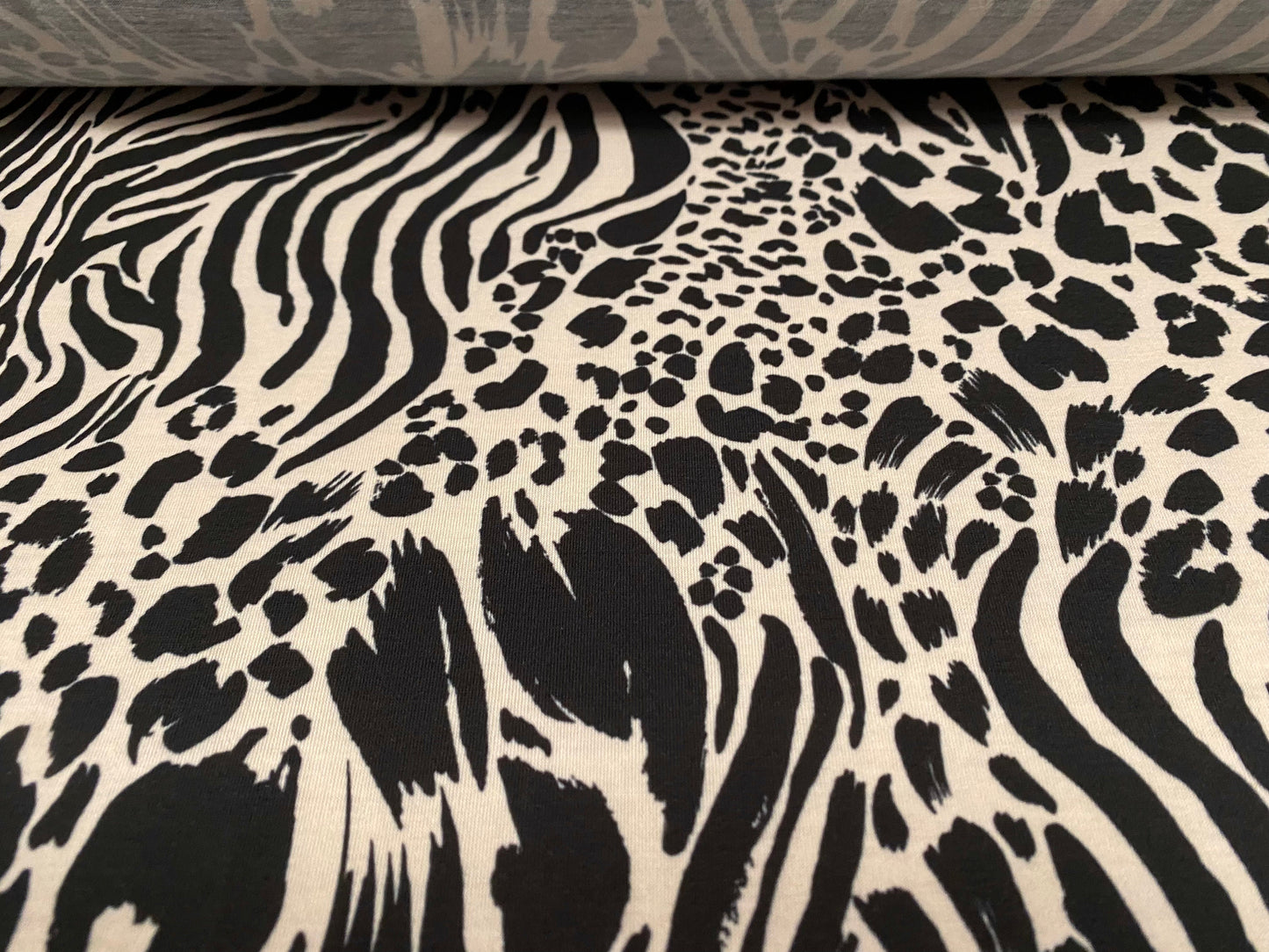 Soft handle stretch jersey fabric, per metre - leopard zebra fusion print - Cream & black