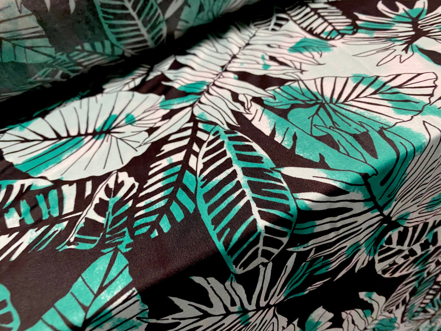 Spandex stretch ITY single jersey fabric, per metre - leaf print - black & green