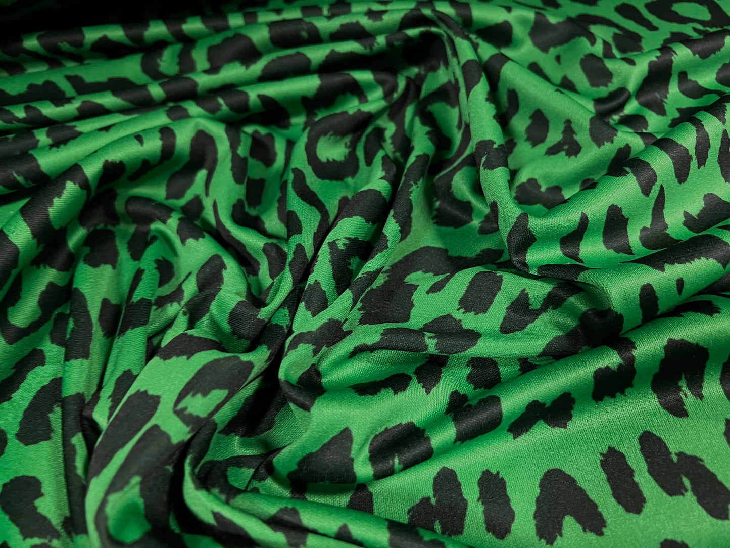 Single jersey fashion fabric - 60 inches wide - cheetah animal print - green & black
