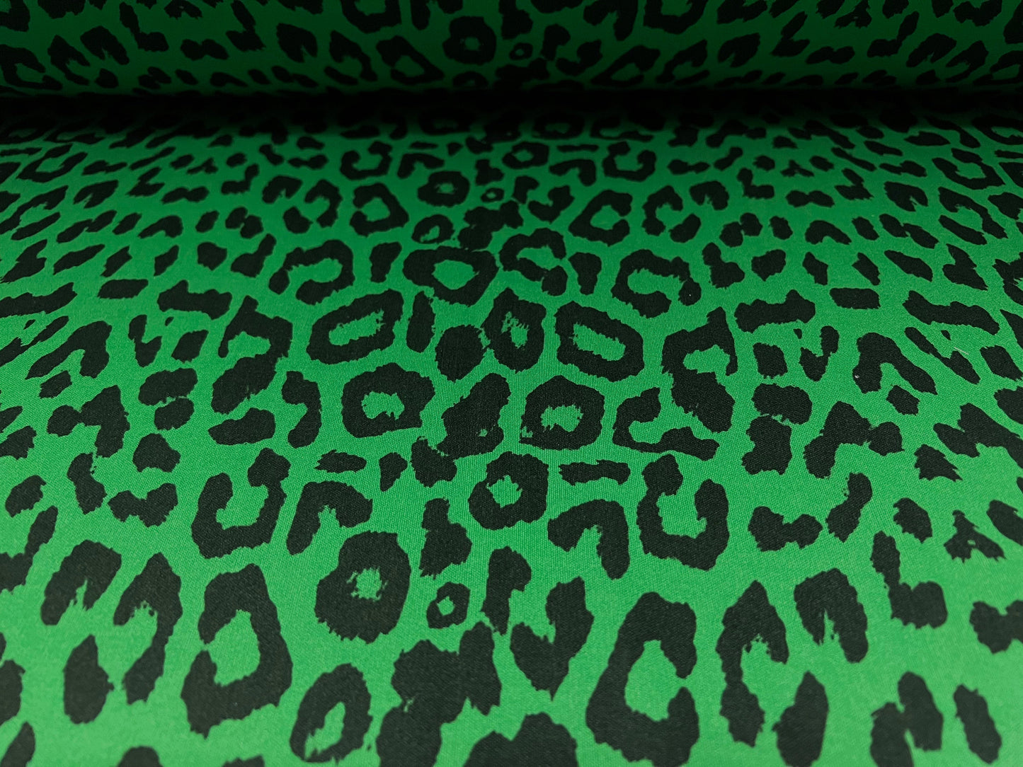 Single jersey fashion fabric - 60 inches wide - cheetah animal print - green & black