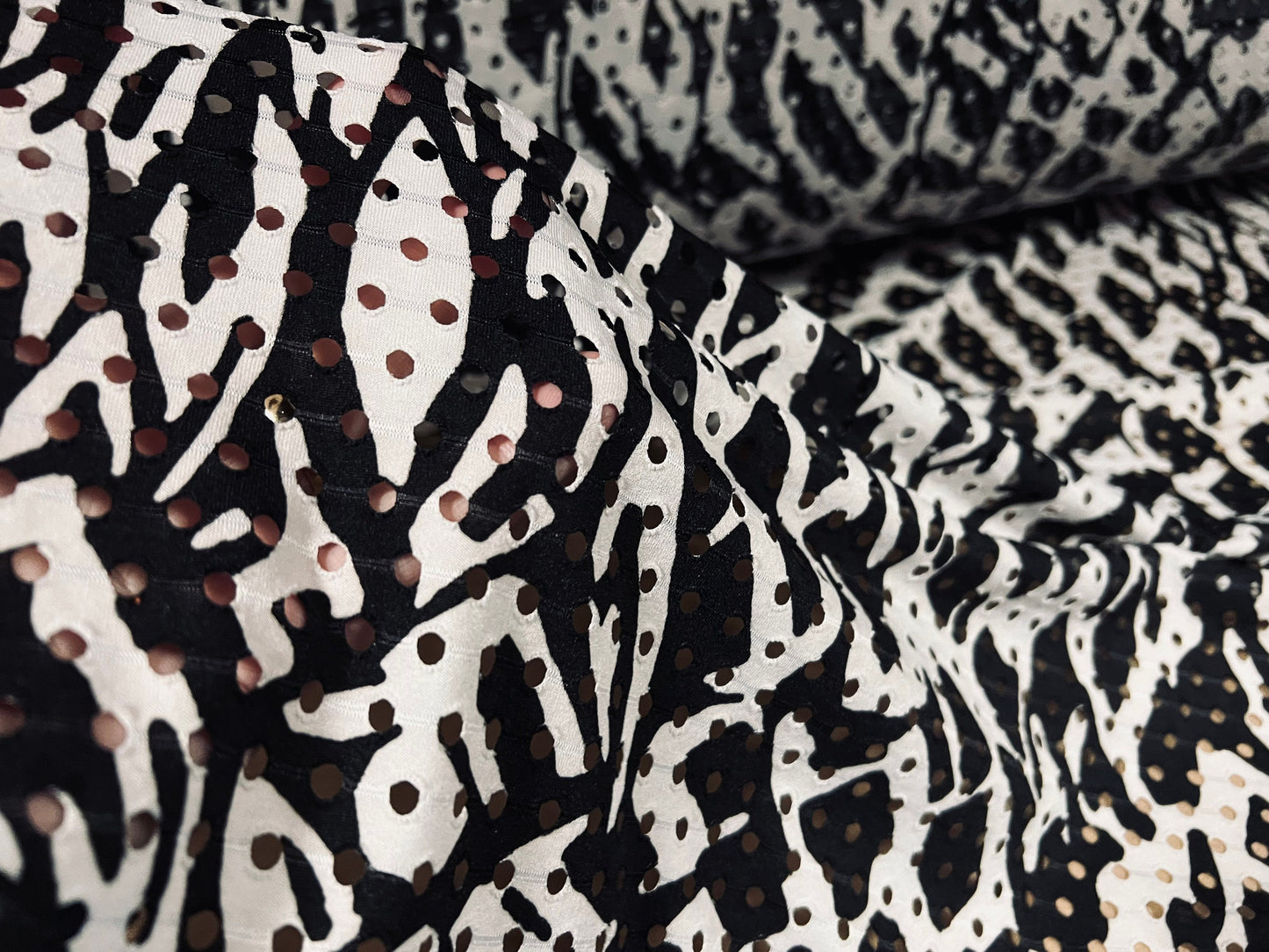 Eyelet stretch spandex single jersey laser cut fabric, per metre - distressed zebra print - black & white