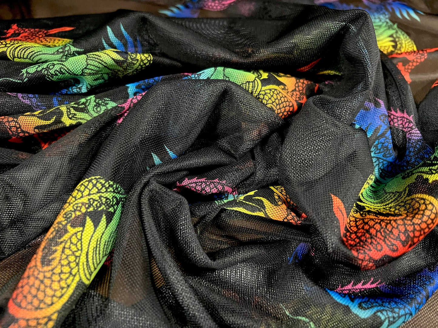 Power mesh net stretch spandex fabric, per metre - dragons print -black & rainbow