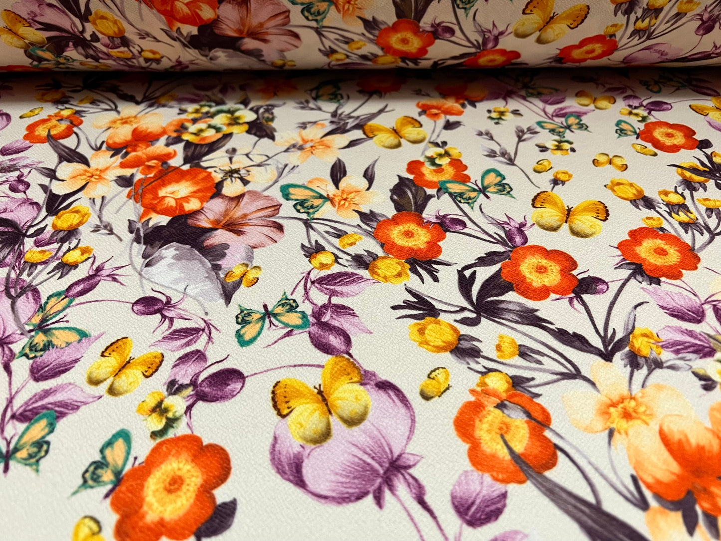 Scuba textured ‘Liverpool’ stretch spandex jersey fabric, per metre - Cream with orange and lilac flowers & butterflies print