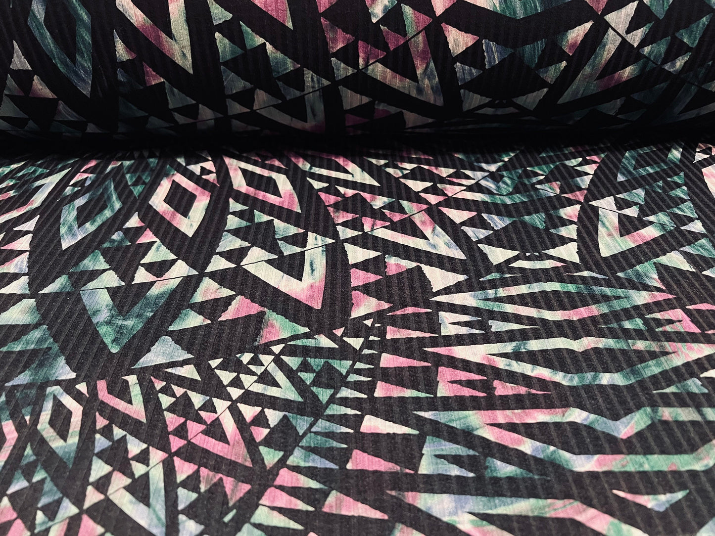 Spandex stretch rib jersey fabric, per metre - geometric tribal swirl print - dark emerald, black & pink