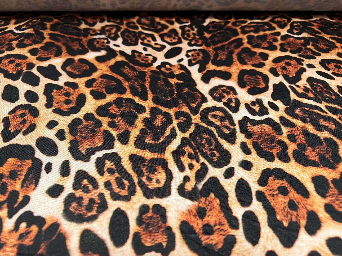 Soft handle single jersey fabric, per metre - Jaguar animal print - gold & brown