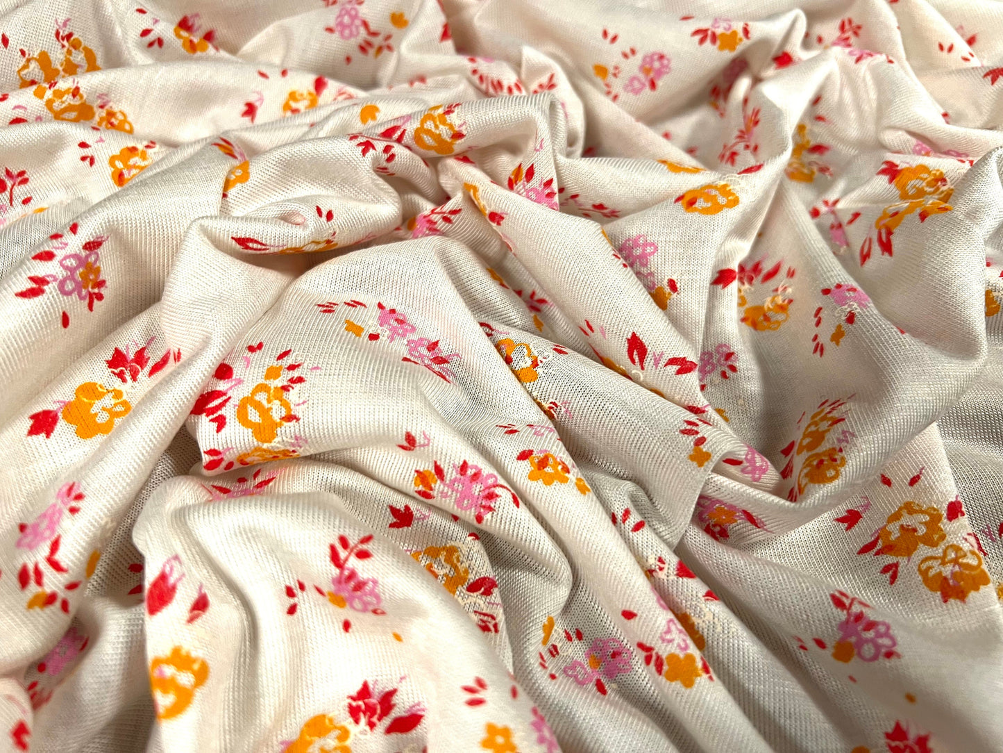 Viscose spandex stretch single jersey fabric, per metre - Ditsy flower print - Cream & orange
