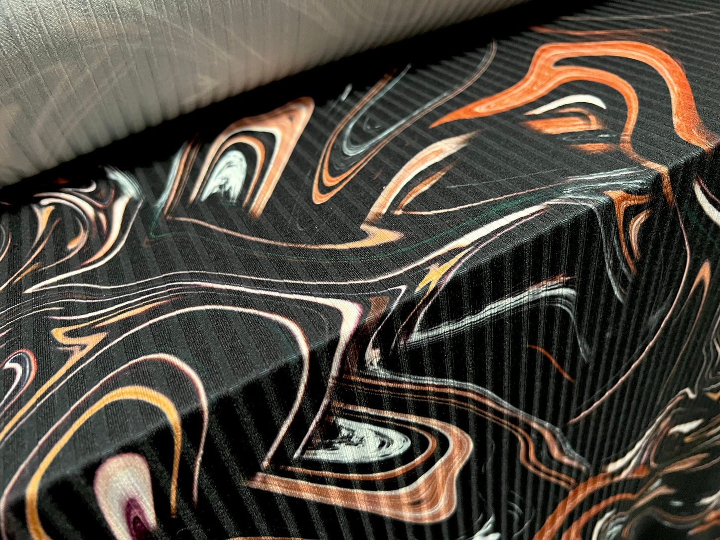 Stretch spandex rib jersey fabric, per metre - swirl print - black & terracotta