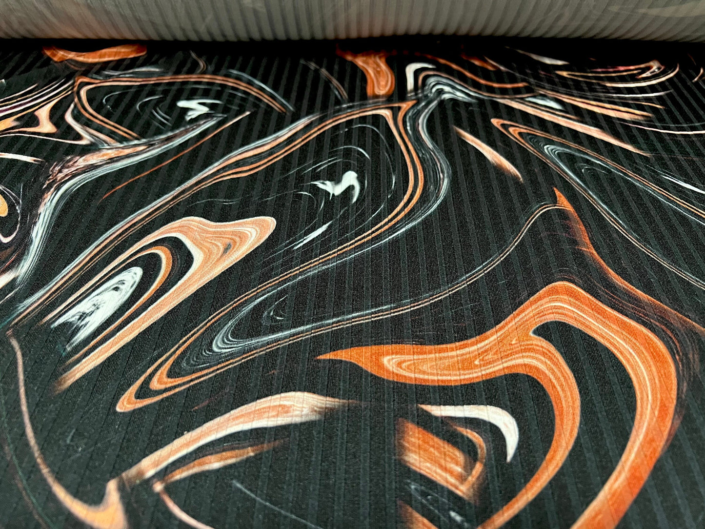 Stretch spandex rib jersey fabric, per metre - swirl print - black & terracotta