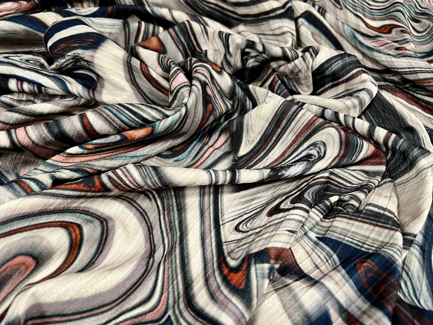 Stretch spandex rib jersey fabric, per metre - swirl print - cream navy orange