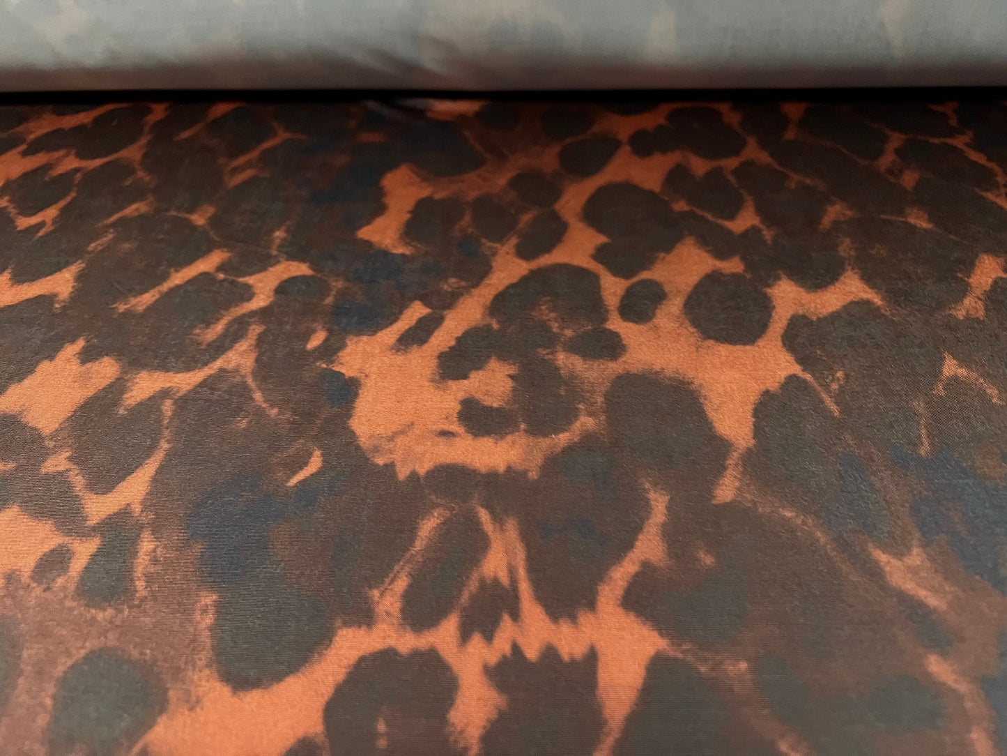 Stretch spandex single jersey fashion fabric, per metre - hyena animal print - chestnut brown black & navy