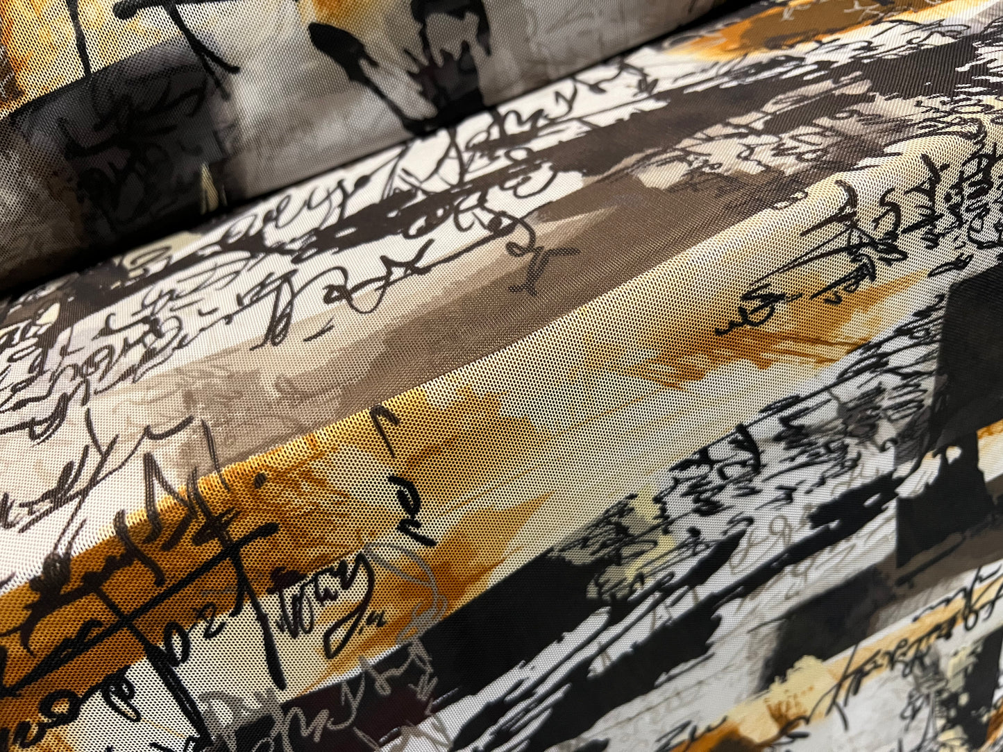 Power mesh net stretch spandex fabric, per metre - scribble print - grey & amber