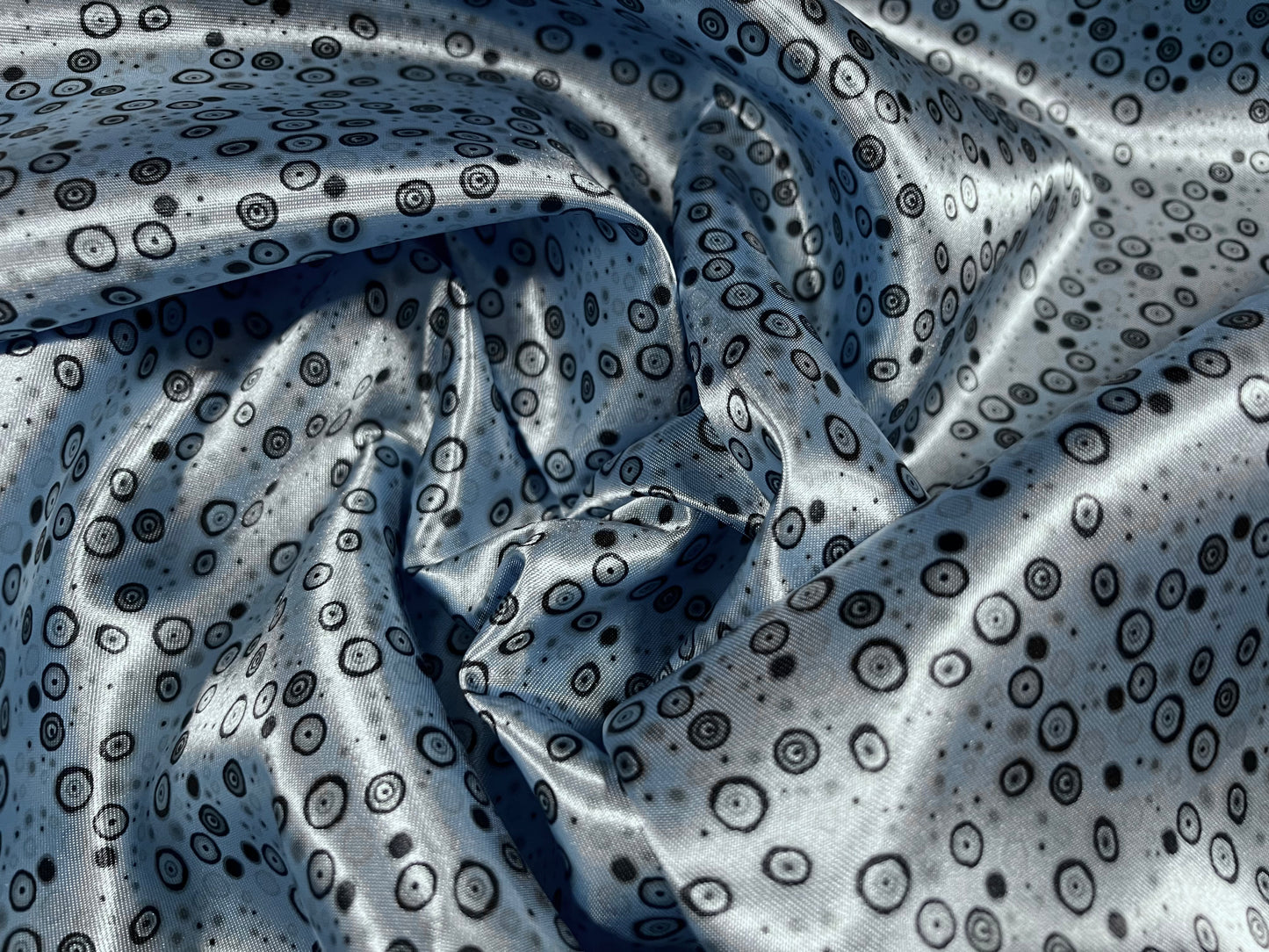 Silky satin woven fabric, per metre - circles print - sky blue & black