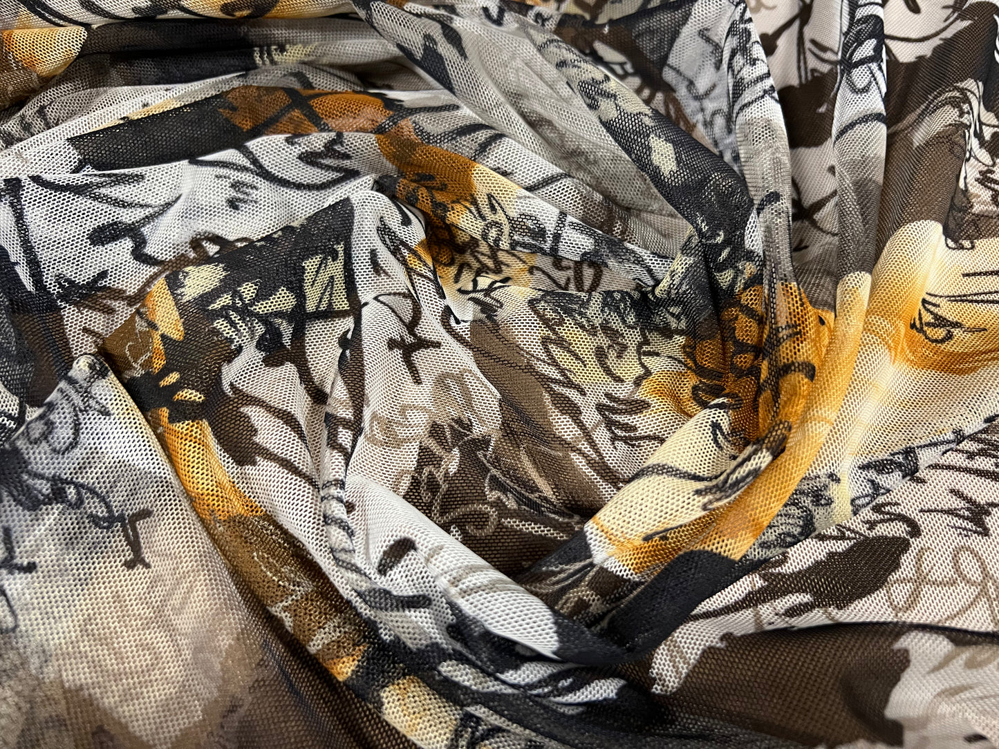 Power mesh net stretch spandex fabric, per metre - scribble print - grey & amber