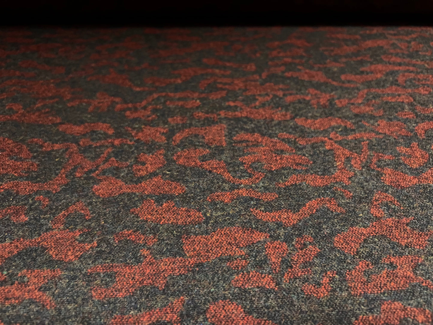 Wool jacquard woven fabric, per metre - abstract swirl - charcoal grey & dark red